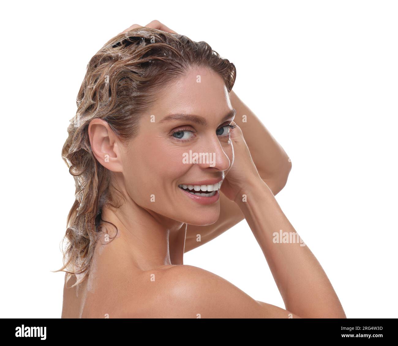 Beautiful happy woman washing hair on white background Stock Photo