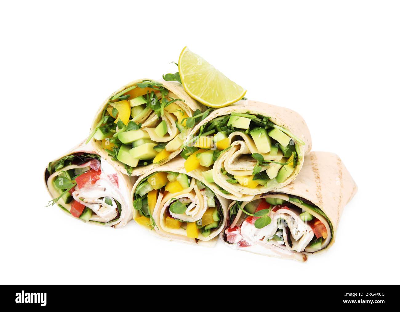 Delicious sandwich wraps with fresh vegetables and slice of lime