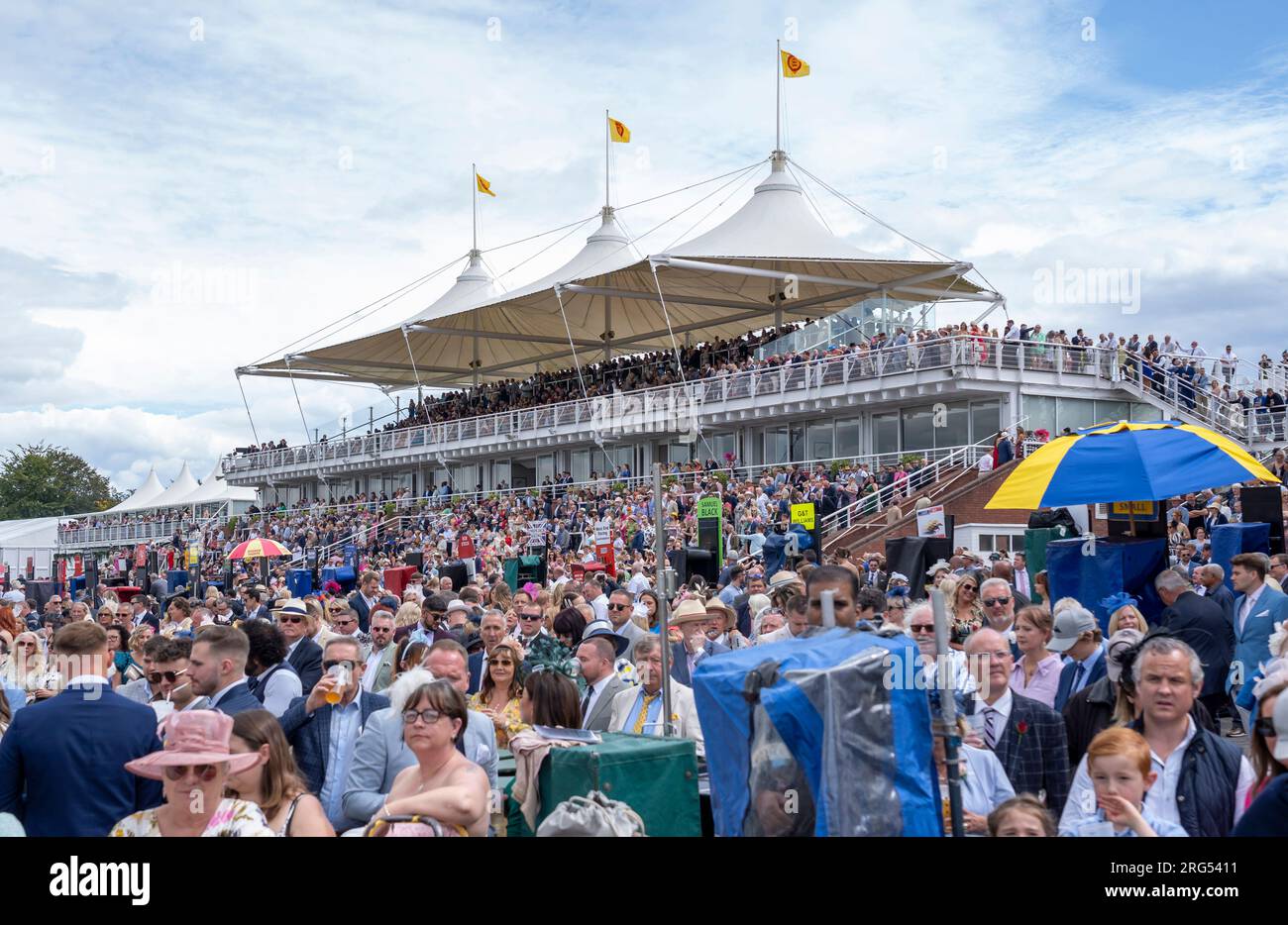 Crowds watching the racing on day 3 of the Qatar Goodwood Festival Meeting 2023 at Goodwood Racecourse, Chichester Stock Photo