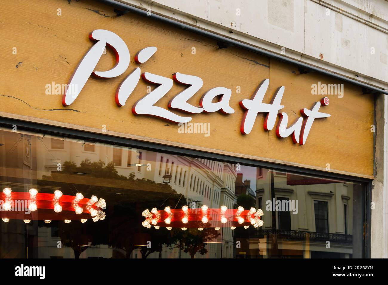 London, UK - July 31, 2023; Pizza Hut sign on store front location in Central London Stock Photo