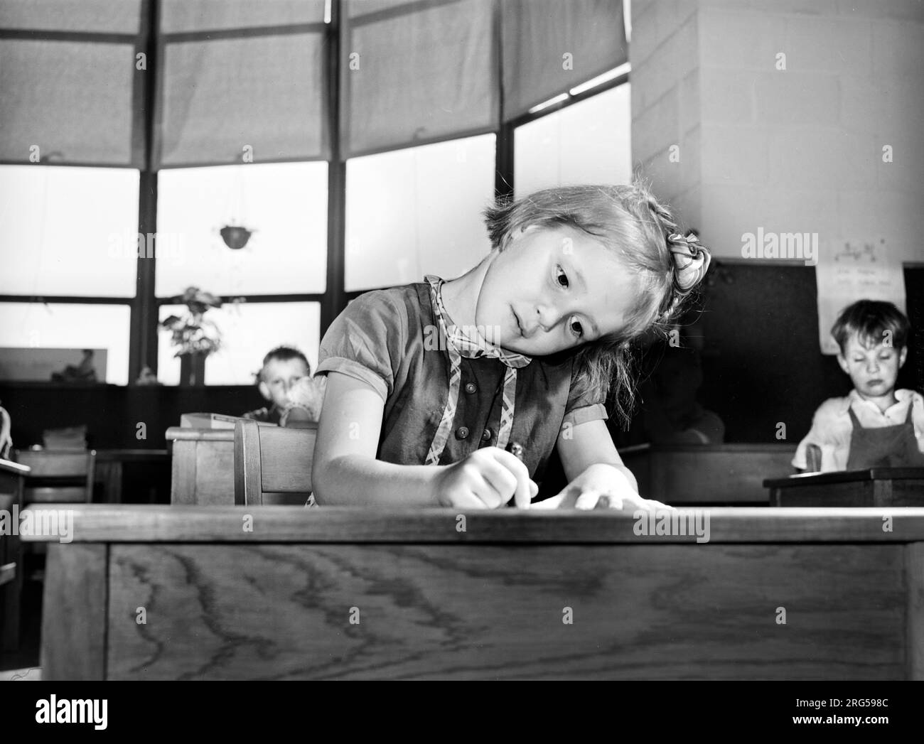 Young girl drawing picture at nursery school, Homestead school, Dailey, West Virginia, USA, Arthur Rothstein, U.S. Farm Security Administration, October 1941 Stock Photo