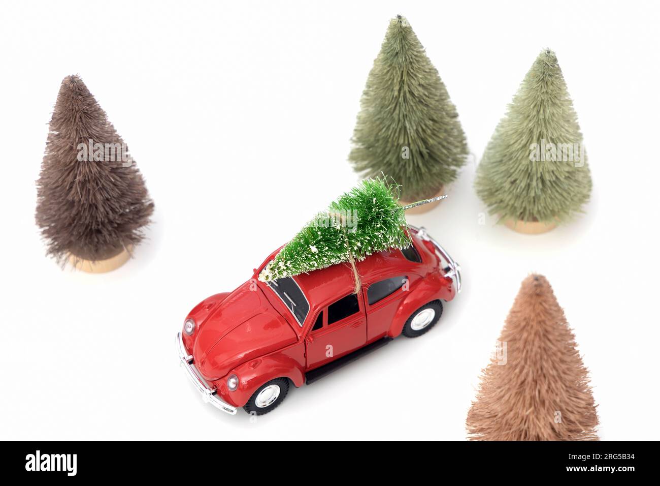 Vintage red car decor with Christmas Tree. Transporting Christmas tree