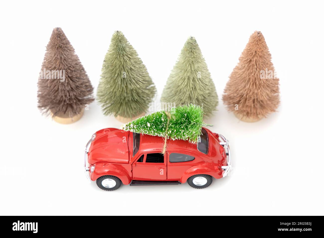 Vintage red car decor with Christmas Tree. Transporting Christmas tree