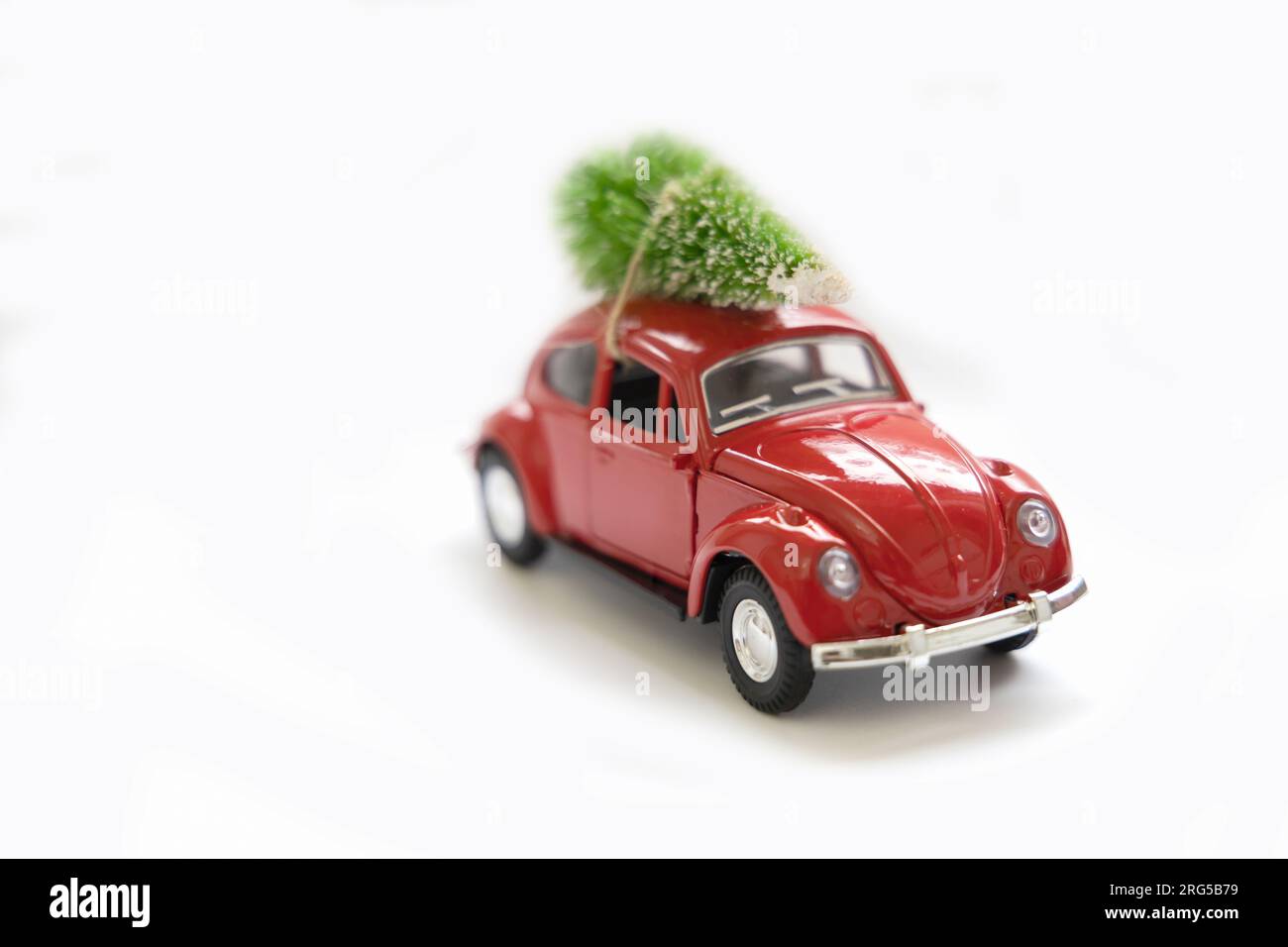 Vintage red car decor with Christmas Tree. Transporting Christmas tree
