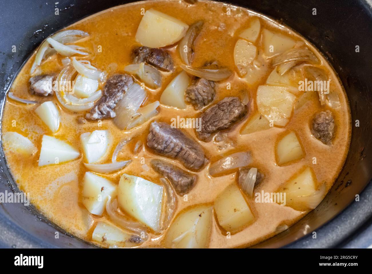 Beef massaman curry made with slow cooked beef, spices and potatoes. Stock Photo