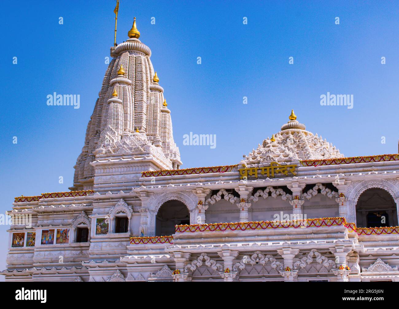Mathura Vrindavan temple, Prem mandir with blue sky in the background , beautiful architecture. Radha Krishna temple. Stock Photo