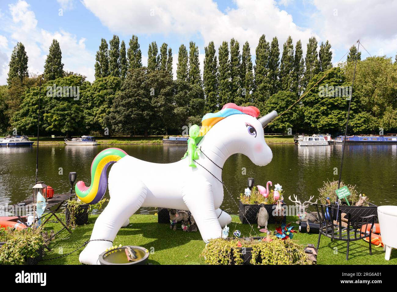 A colourful My Little Pony rainbow coloured unicorn on the banks of the River Thames, Kingston, Surrey, England, U.K. Stock Photo