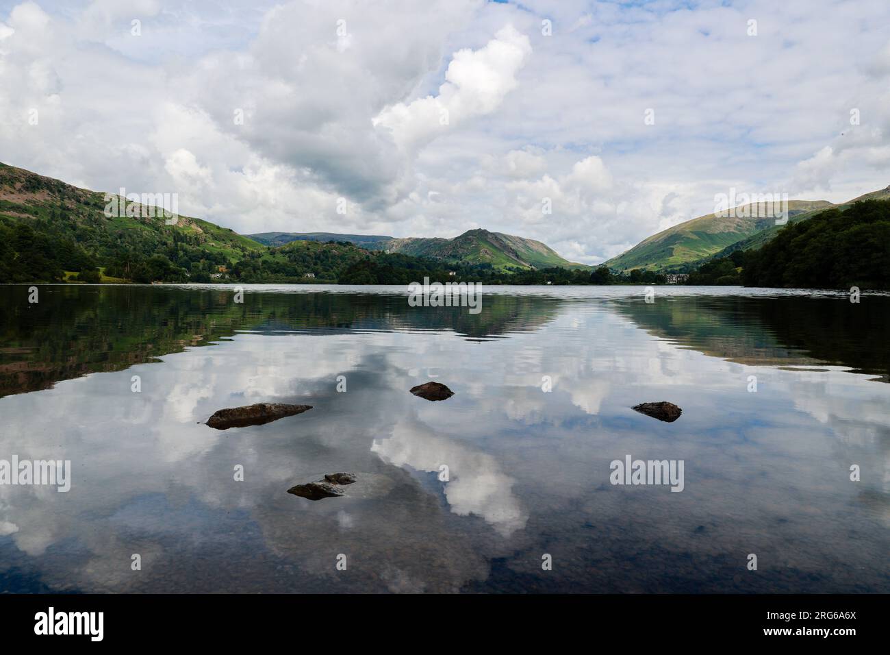 Reflections of a cloudy sky in Grasmere, Lake District, UK Stock Photo