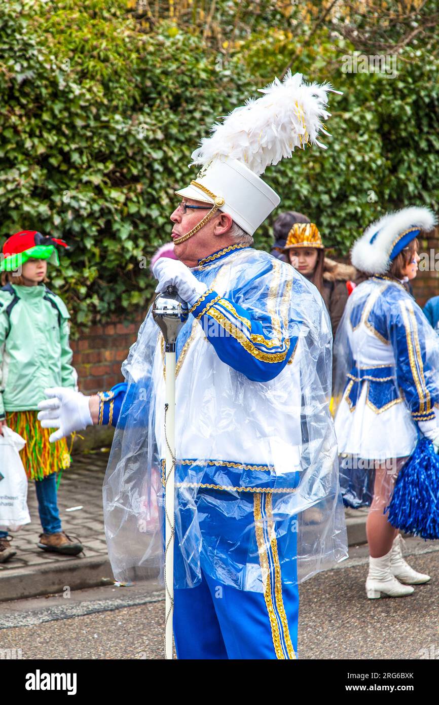 SCHWALBACH, GERMANY - FEBRUARY 27: The carnival  brass band  moves through the city on February 27, 2011 in Schwalbach, Germany. The Brass Band Rheinm Stock Photo