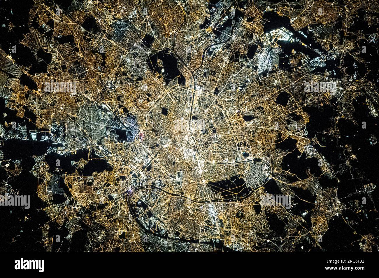 View from space of Paris, France, at night with the Seine River flowing through the middle. Stock Photo