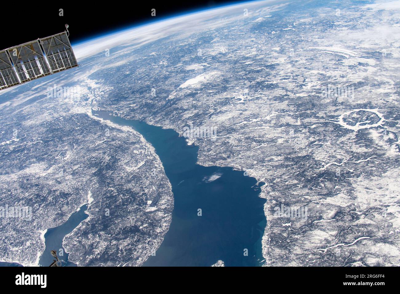 View from space of Manicouagan Crater (right center) and the St. Lawrence River in Quebec. Stock Photo