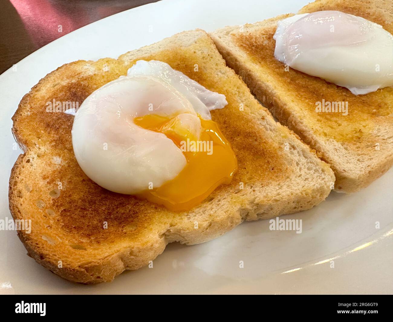 Two poached eggs on toast Stock Photo