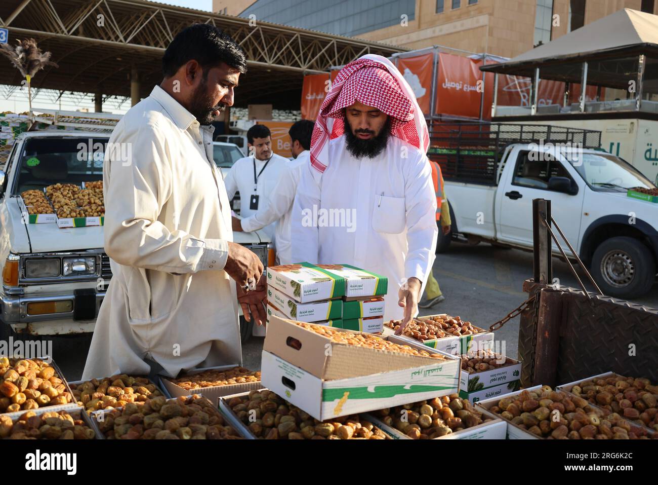 Qassim, Saudi Arabia. 7th Aug, 2023. People sell boxes of dates at the