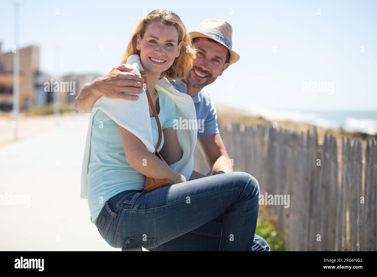 happy couple hugging and contemplating the sea Stock Photo - Alamy