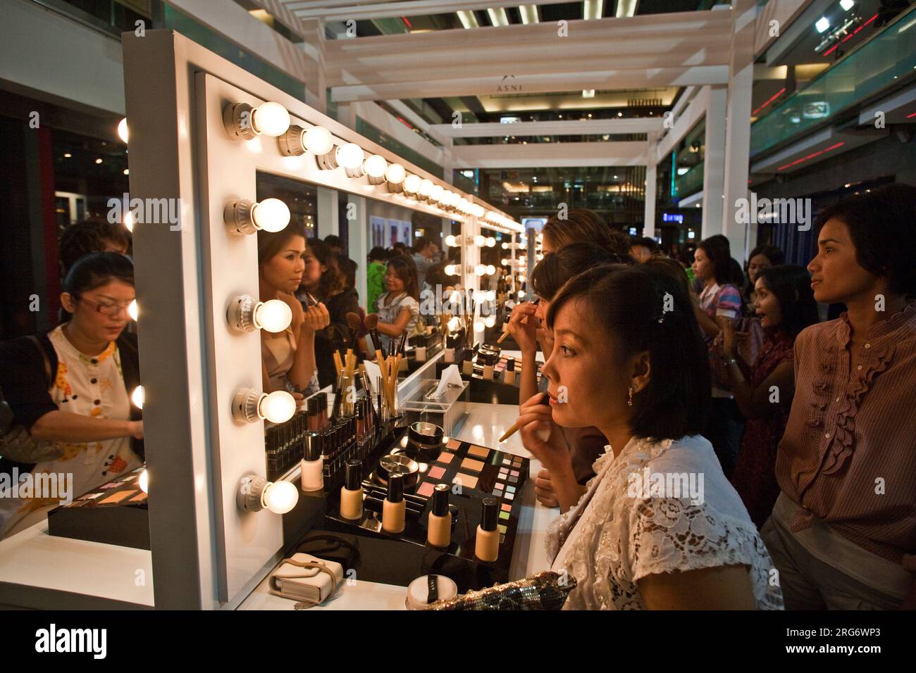 BANGKOK, THAILAND - May 11: cosmetic company AMWAY sponsores a makeup course with its products in the central world center and assists woman in using Stock Photo