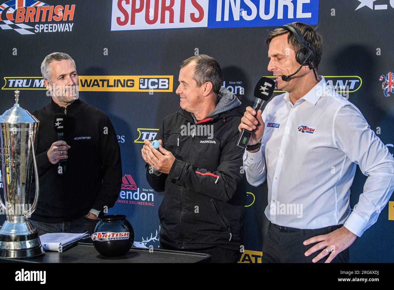 The Draw for the British Final is made, introduces by Scott Nicholls (left). Draw made by TT Champion John McGuinness (Centre) with Premiership CEO Phil Morris (right) during the Sports Insure Premiership match between Belle Vue Aces and Sheffield Tigers at the National Speedway Stadium, Manchester on Monday 7th August 2023. (Photo: Ian Charles | MI News) Credit: MI News & Sport /Alamy Live News Stock Photo