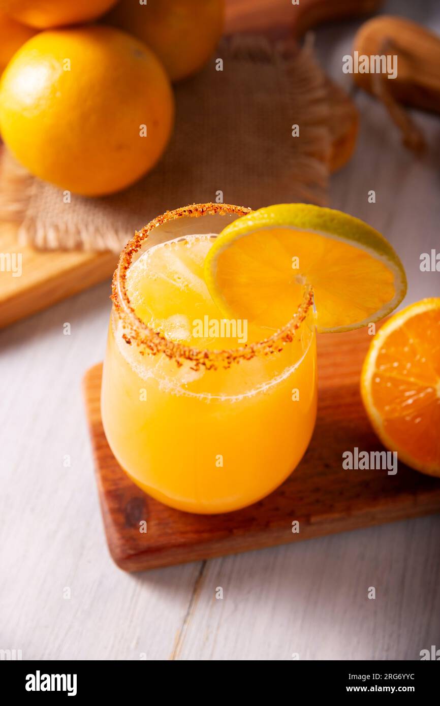 Refreshing homemade orangeade, a natural hydrating drink made from orange juice, very popular in several countries, ideal to drink in hot summers. Stock Photo