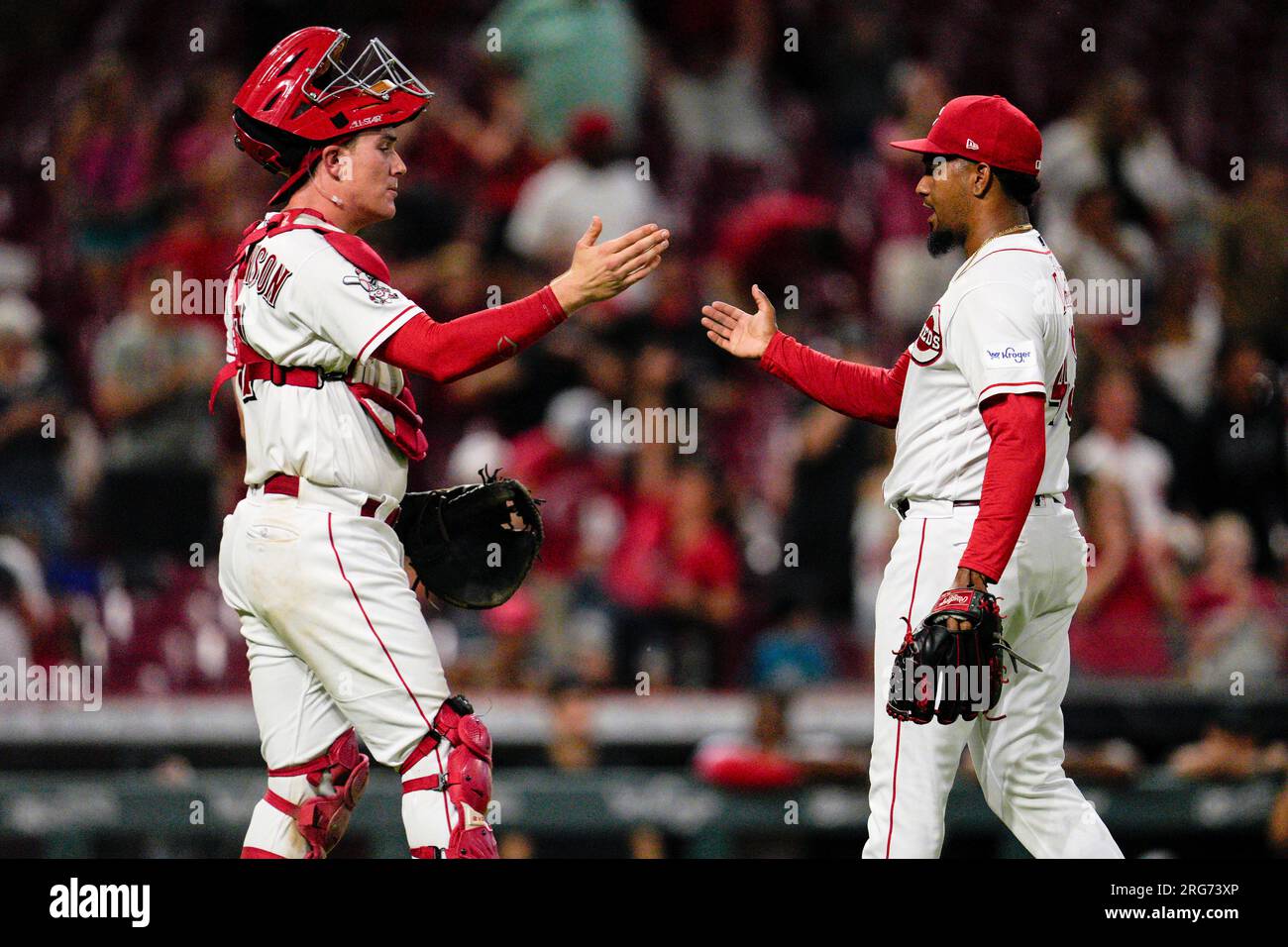 Cincinnati Reds relief pitcher Alexis Diaz, right, celebrates with ...