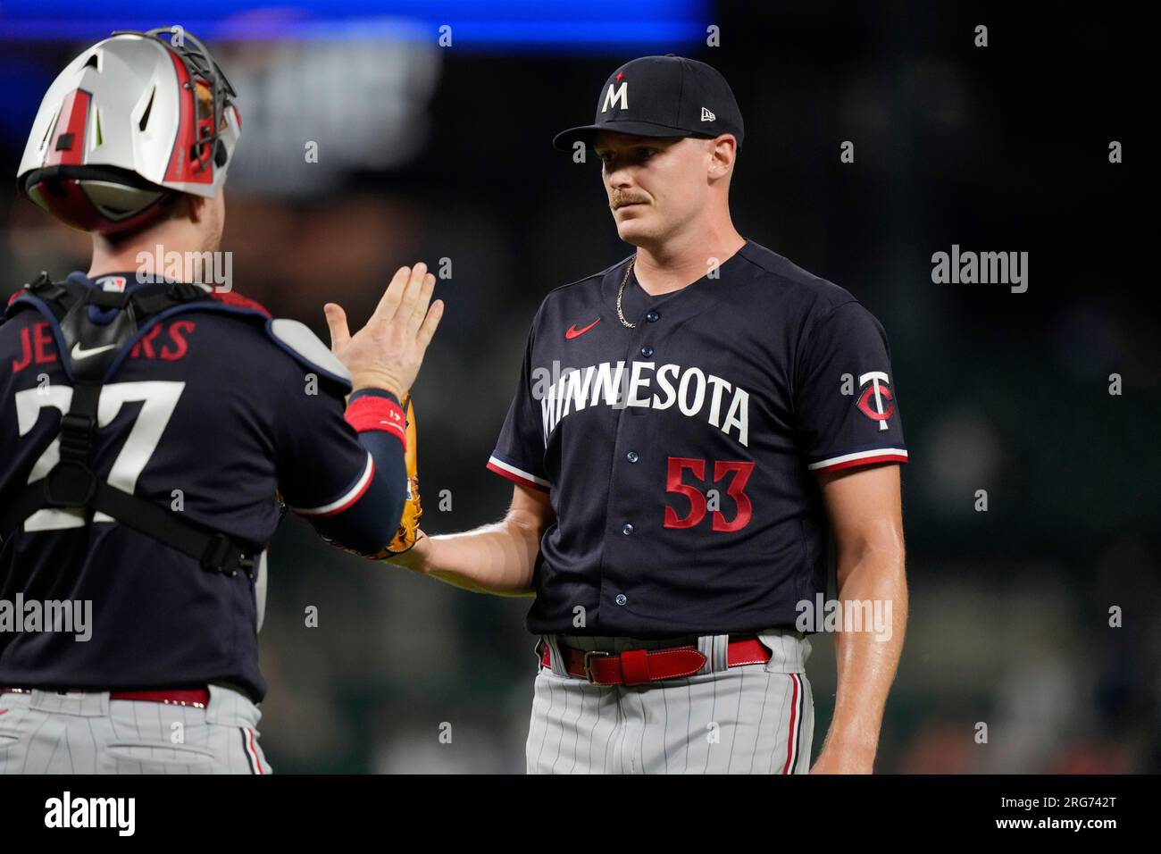 Minnesota Twins relief pitcher Brent Headrick shakes hands with catcher