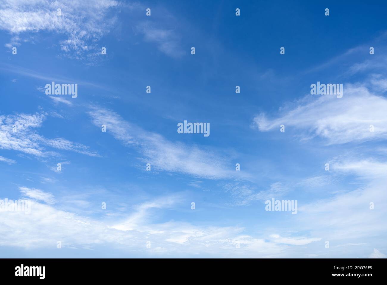 Blue sky and white cirrocumulus clouds texture background. Blue sky on sunny day. Summer sky. Cloud formation. Fluffy clouds. Nice weather in summer Stock Photo