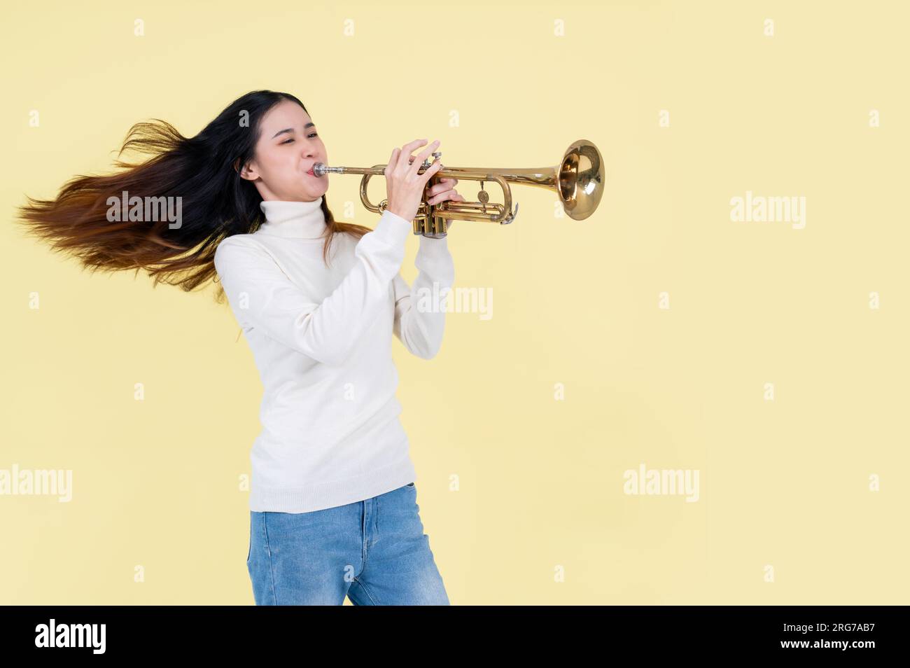 Child blow on trumpet hi-res stock photography and images - Alamy