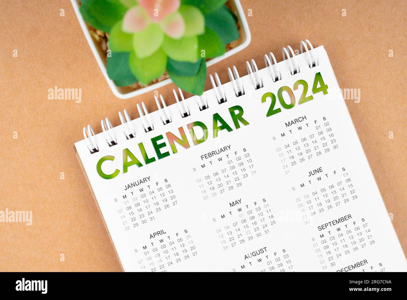 12 months desk calendar 2024 on brown background Stock Photo Alamy