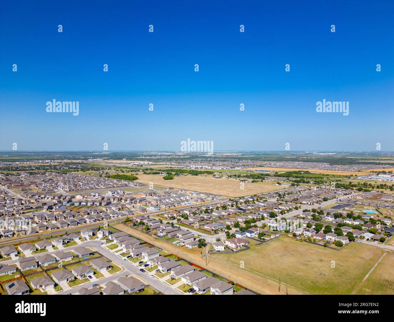 Aerial drone photo homes in Manor Texas neighborhoods growing Stock