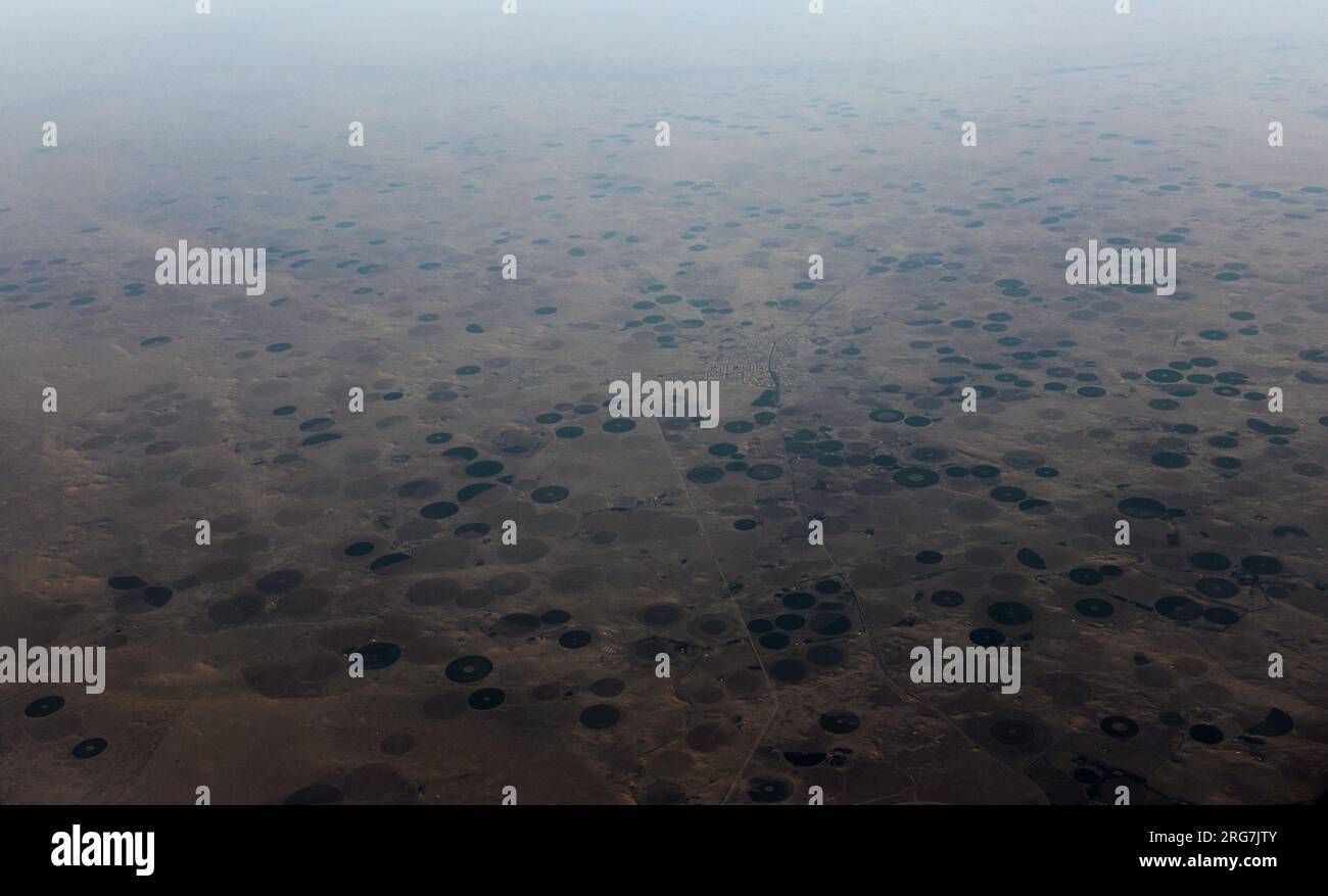 Aerial view of circular agriculture fields in the Arabian desert in Saudi Arabia. Stock Photo