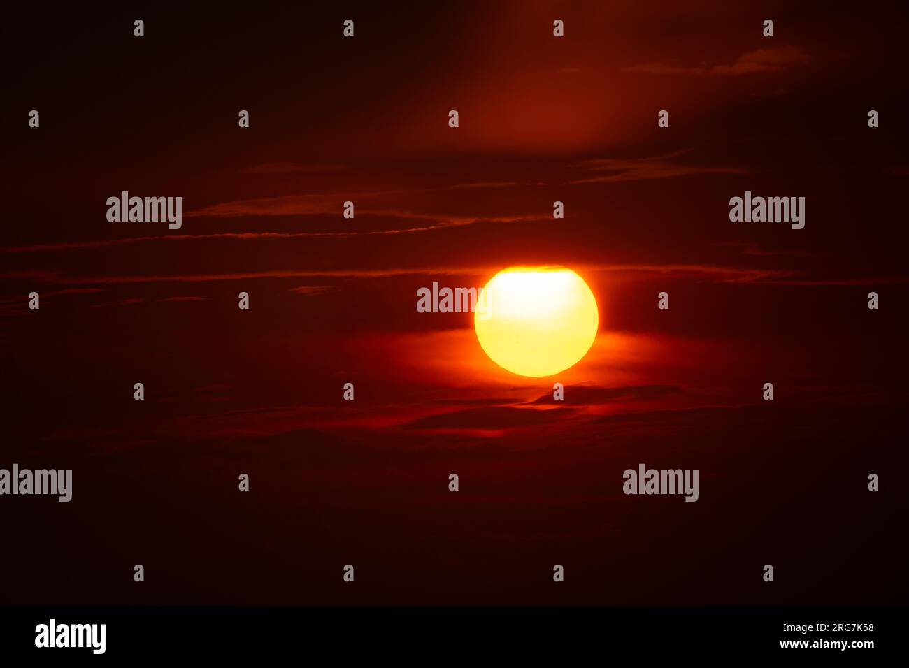 Sunset on sky dark background, big sun golden color on dusk twilight ...