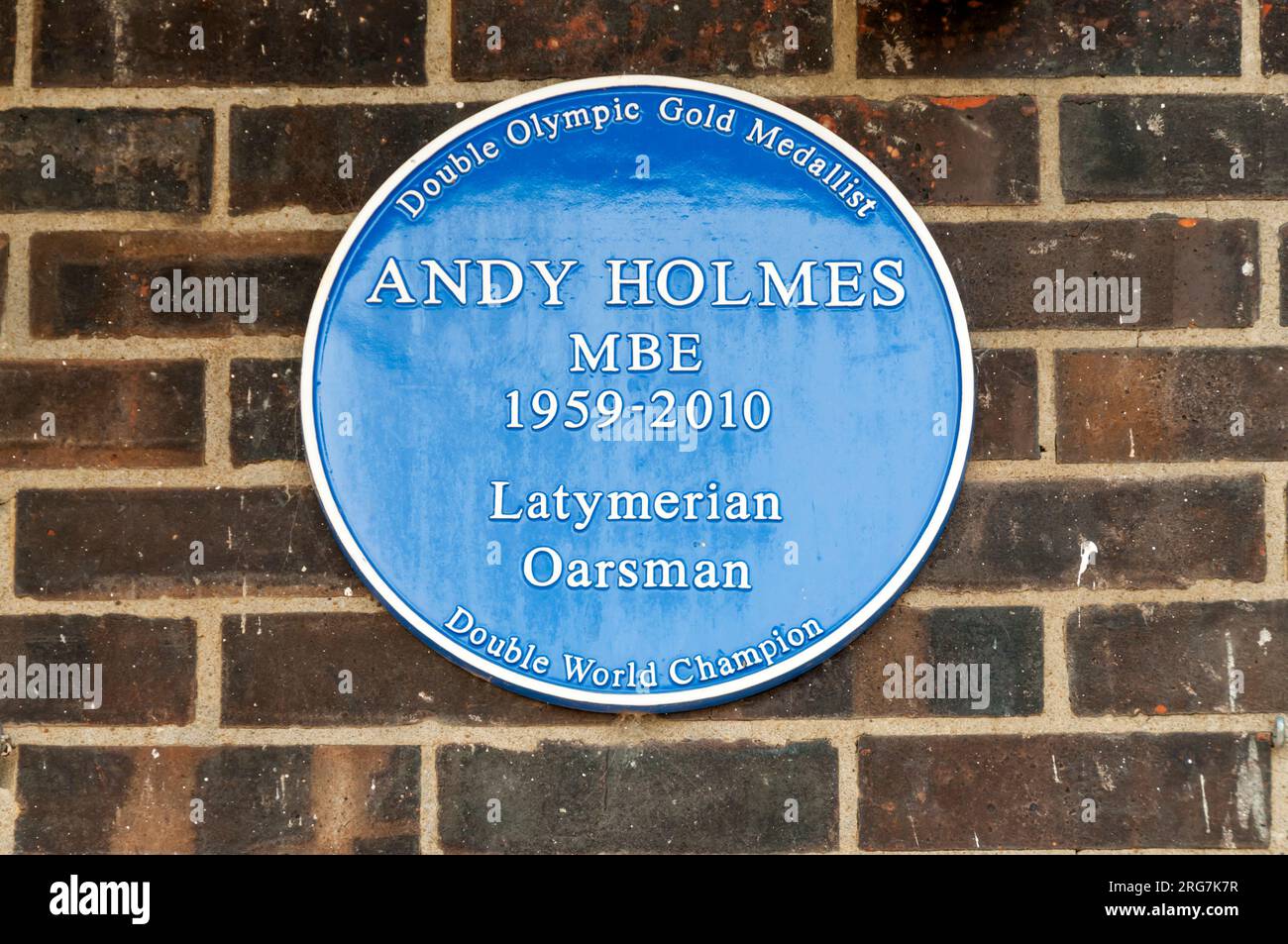 A blue plaque commemorating Andy Holmes MBE, on a boathouse in Upper Mall, Hammersmith. Stock Photo
