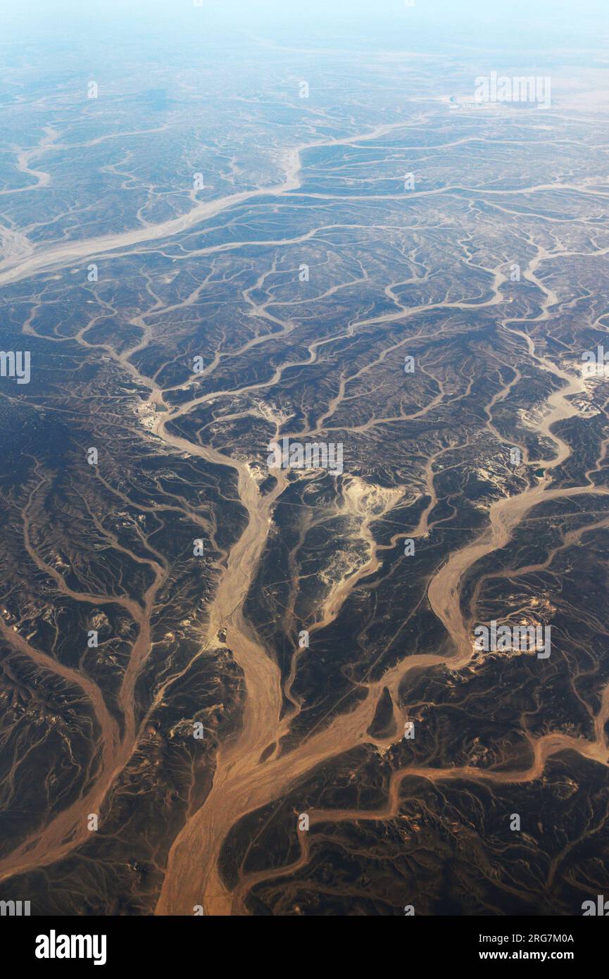 A Surreal aerial view of dried river beds in the desert in Jordan near