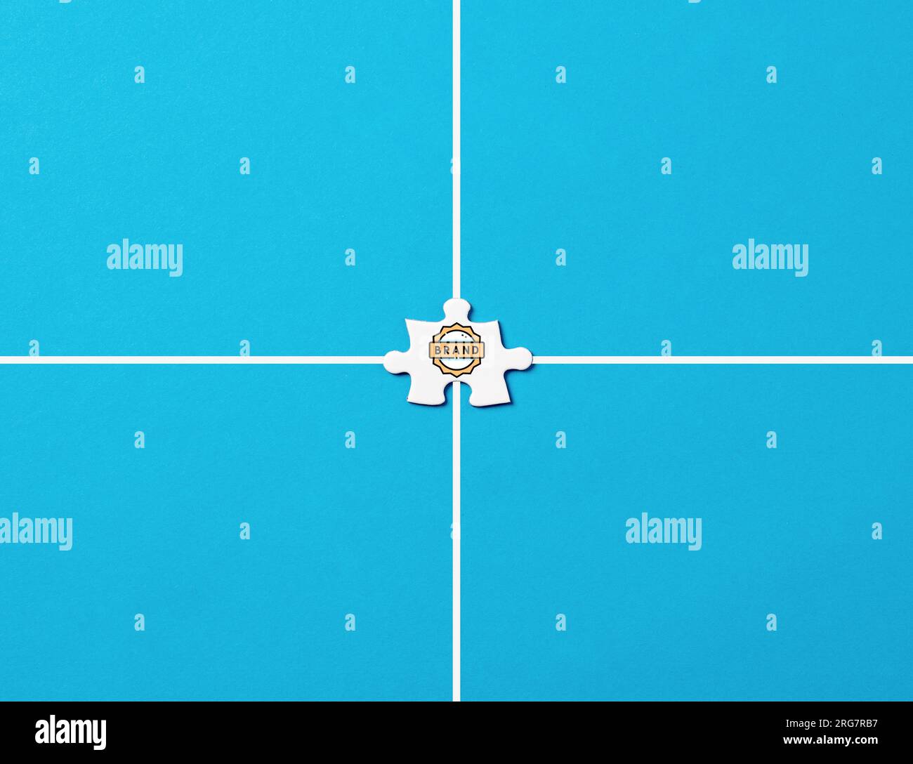 Branding or brand name concept. Brand symbol on a jigsaw puzzle piece on blue background. Stock Photo