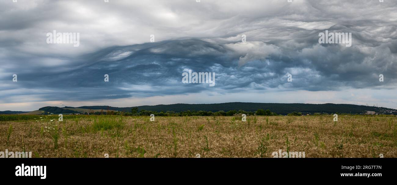 Panorama of a chaotic stormy sky over rural Transylvania in central Romania Stock Photo