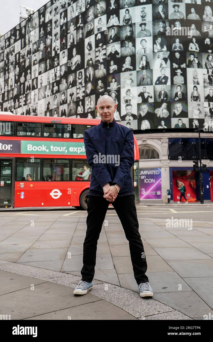 Photographic artist Ray Burmiston at the launch of his new exhibition 'Art of London presents Take A Moment 2023' at the Piccadilly Lights, central London. The displays across the West End will feature hundreds of famous faces with their eyes closed for mental health awareness. Picture date: Tuesday August 8, 2023. Stock Photo