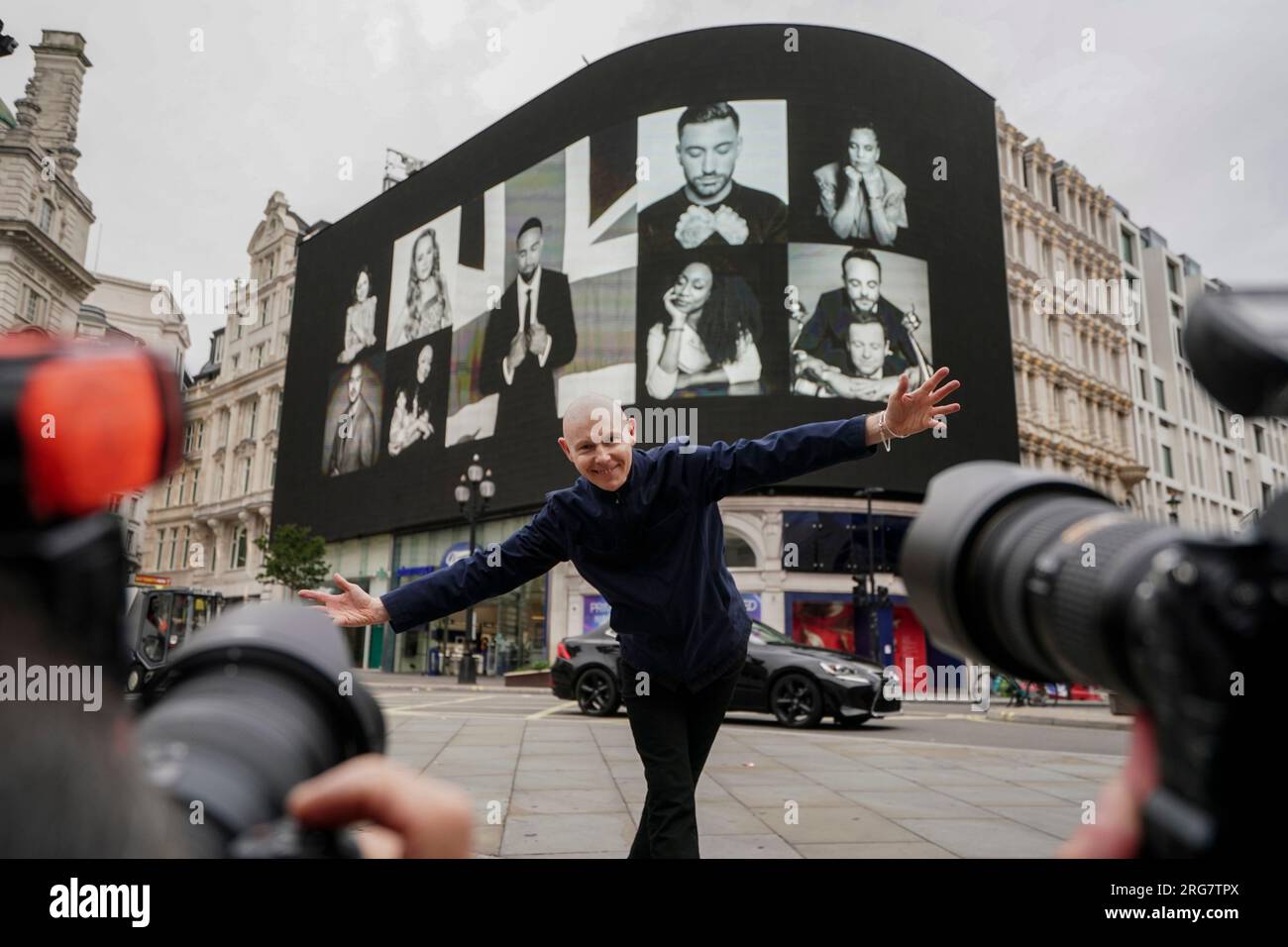 Photographic artist Ray Burmiston at the launch of his new exhibition 'Art of London presents Take A Moment 2023' at the Piccadilly Lights, central London. The displays across the West End will feature hundreds of famous faces with their eyes closed for mental health awareness. Picture date: Tuesday August 8, 2023. Stock Photo