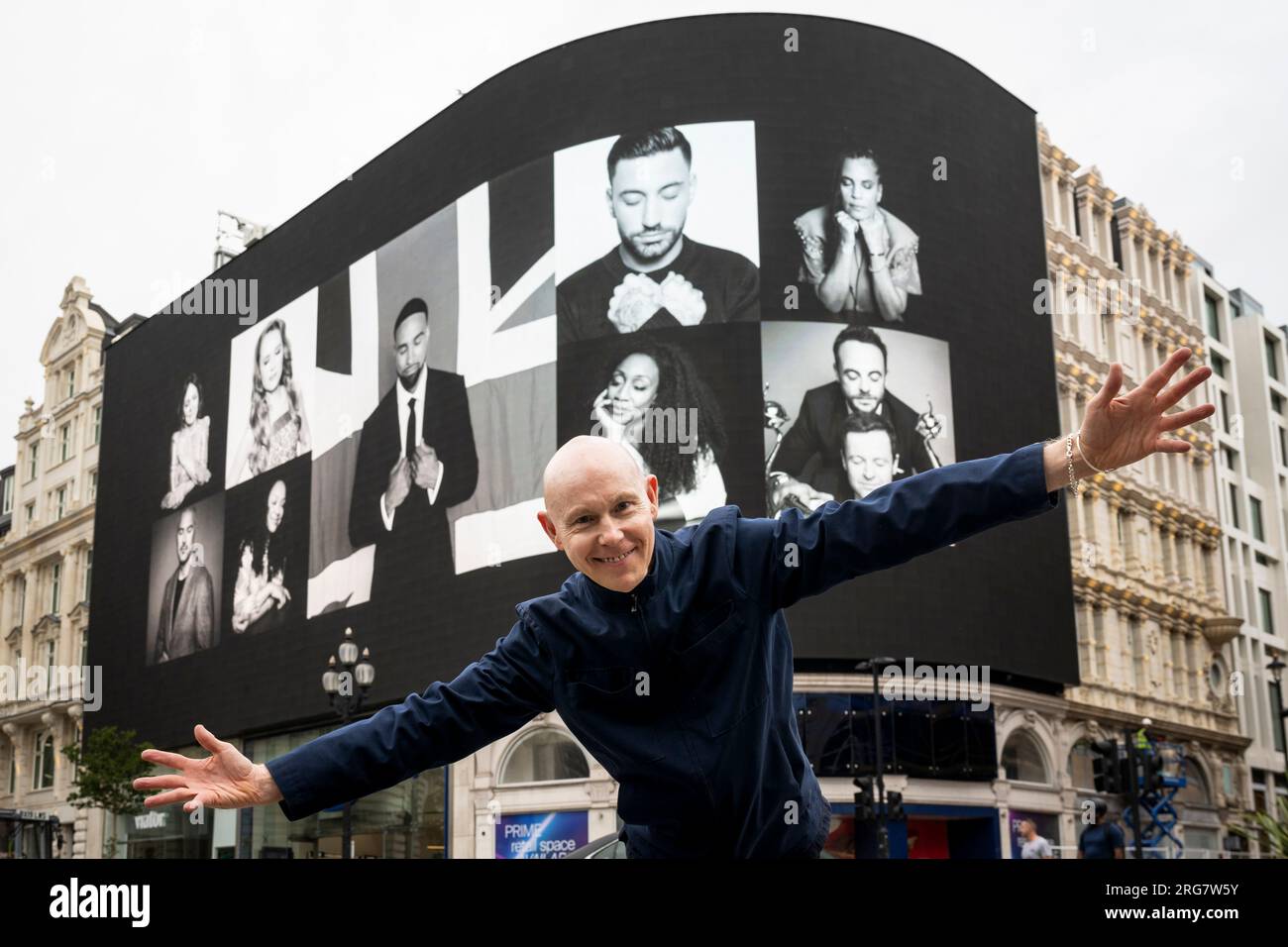London, UK.  8 August 2023. Photographic artist Ray Burmiston at the launch of ‘Art of London Presents Take A Moment 2023’, his new photography exhibition featuring hundreds of famous faces with their eyes closed for mental health awareness.  Faces, including Ashley Banjo and Ant & Dec, are seen on the big screens at Piccadilly Circus, ahead of an exhibition in the National Portrait Gallery in September.  Credit: Stephen Chung / Alamy Live News Stock Photo