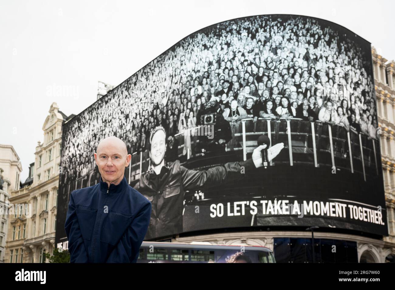 London, UK.  8 August 2023. Photographic artist Ray Burmiston at the launch of ‘Art of London Presents Take A Moment 2023’, his new photography exhibition featuring hundreds of famous faces with their eyes closed for mental health awareness.  Faces, including Olly Murs, are seen on the big screens at Piccadilly Circus, ahead of an exhibition in the National Portrait Gallery in September.  Credit: Stephen Chung / Alamy Live News Stock Photo