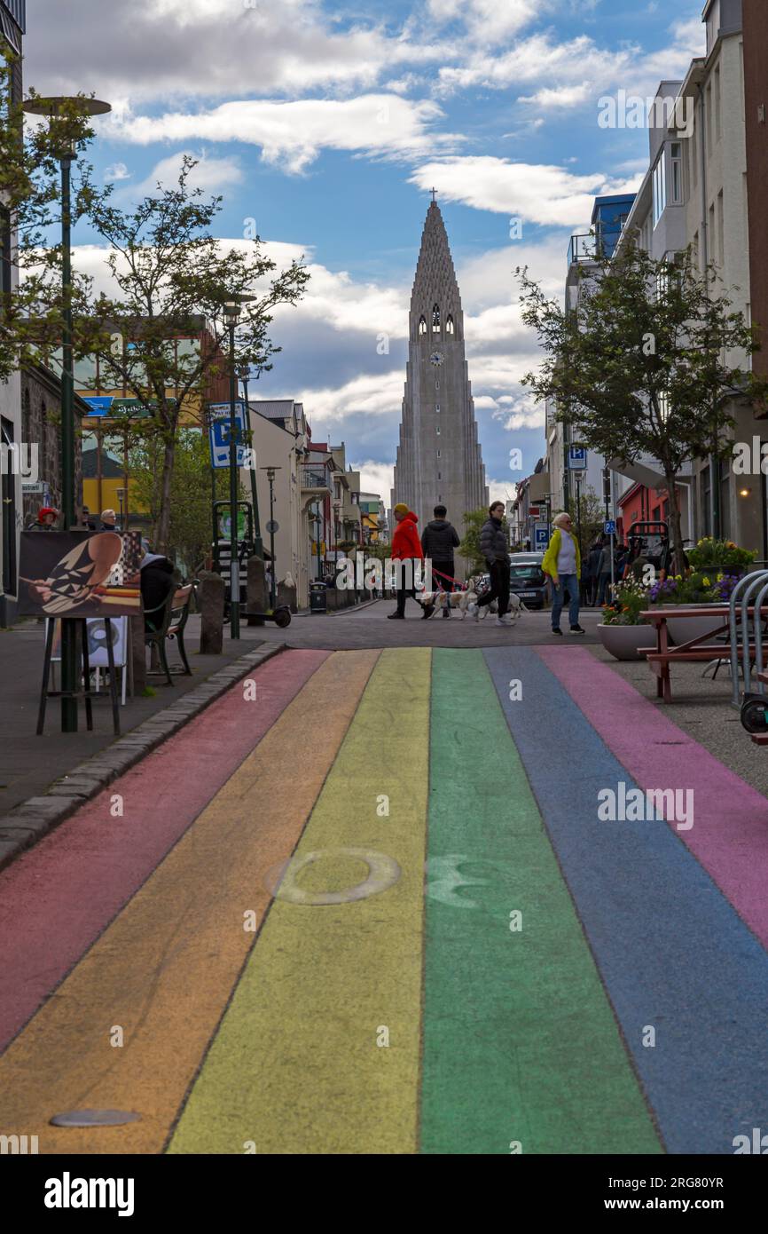 Skolavoerdustigur Street painted in rainbow colours for the annual Gay Pride Festival leading to Hallgrímskirkja church at Reykjavik, Iceland in July Stock Photo