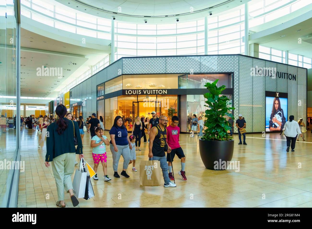 Toronto, Canada, Group of people inside the Yorkdale shopping mall or  centre. The Luis Vuitton store in the background Stock Photo - Alamy