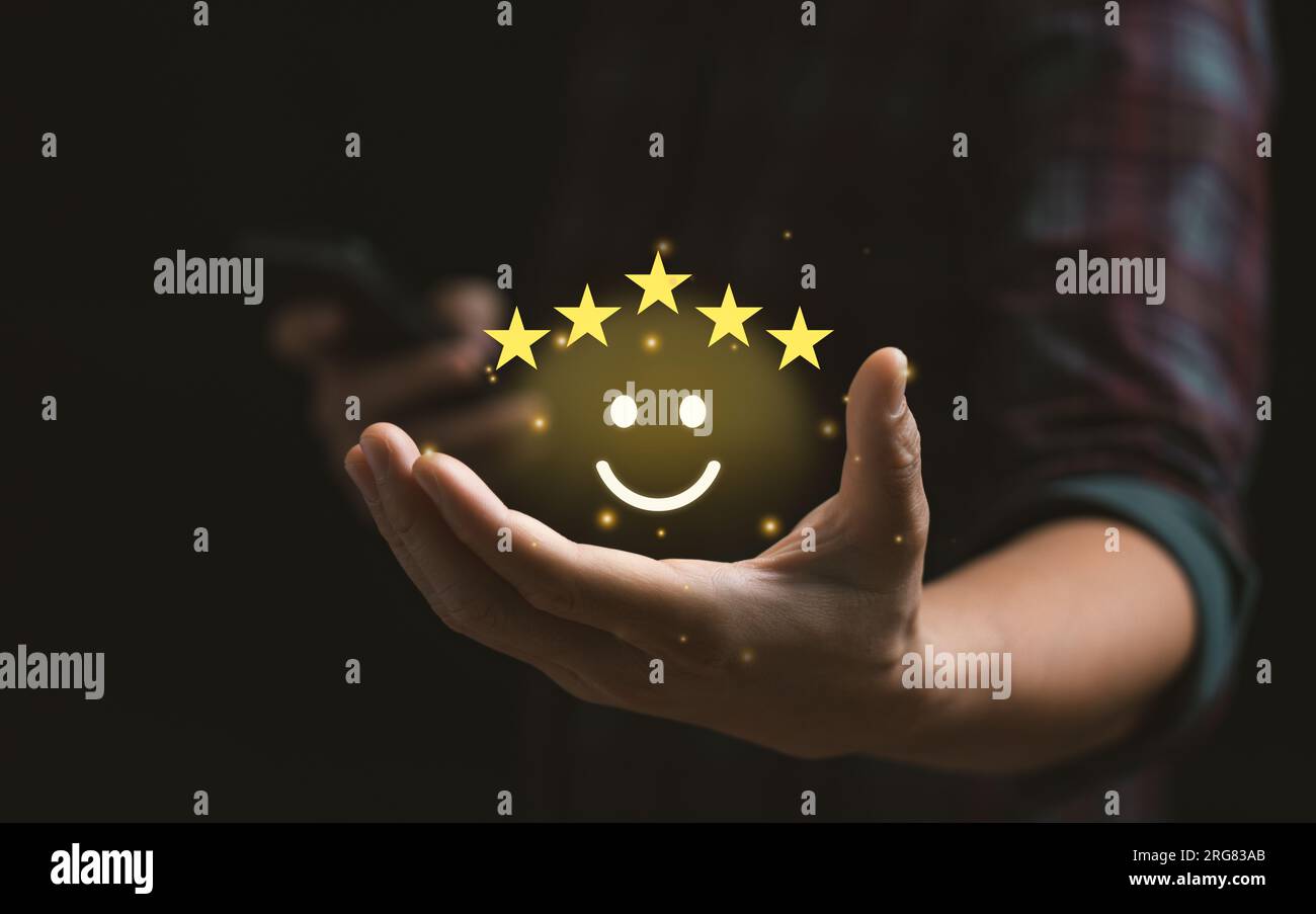 Customer satisfaction concept. Hand with thumb up Positive emotion smiley face icon and five star with copy space. 5 star satisfaction, Excellent busi Stock Photo