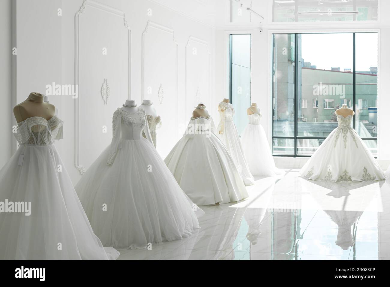 Beautiful wedding bridal dresses on mannequin in showroom in mall Stock Photo Alamy