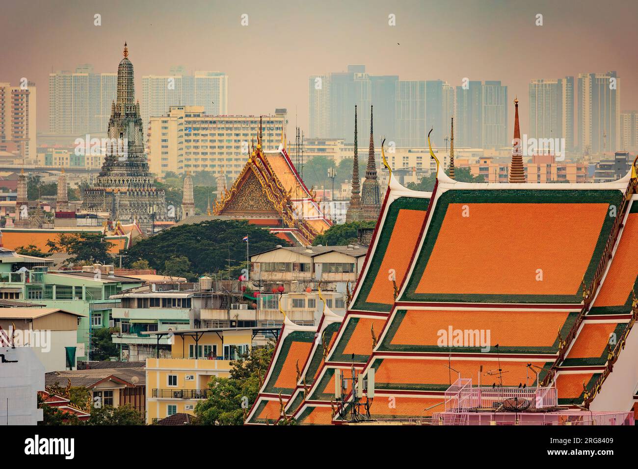 View on the Bangkok old city and the Wat Arun temple with modern city. Stock Photo