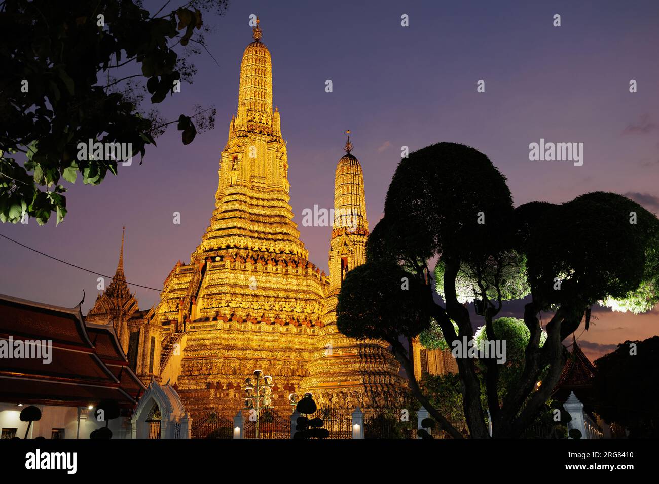 Illuminated old Buddhist temple Wat Arun in Bangkok Stock Photo