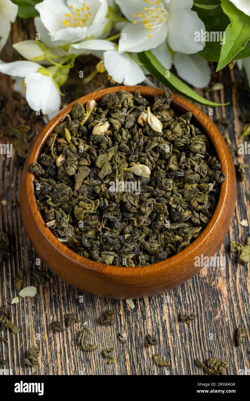 A real green hour with jasmine on the table, dried tea leaf for brewing
