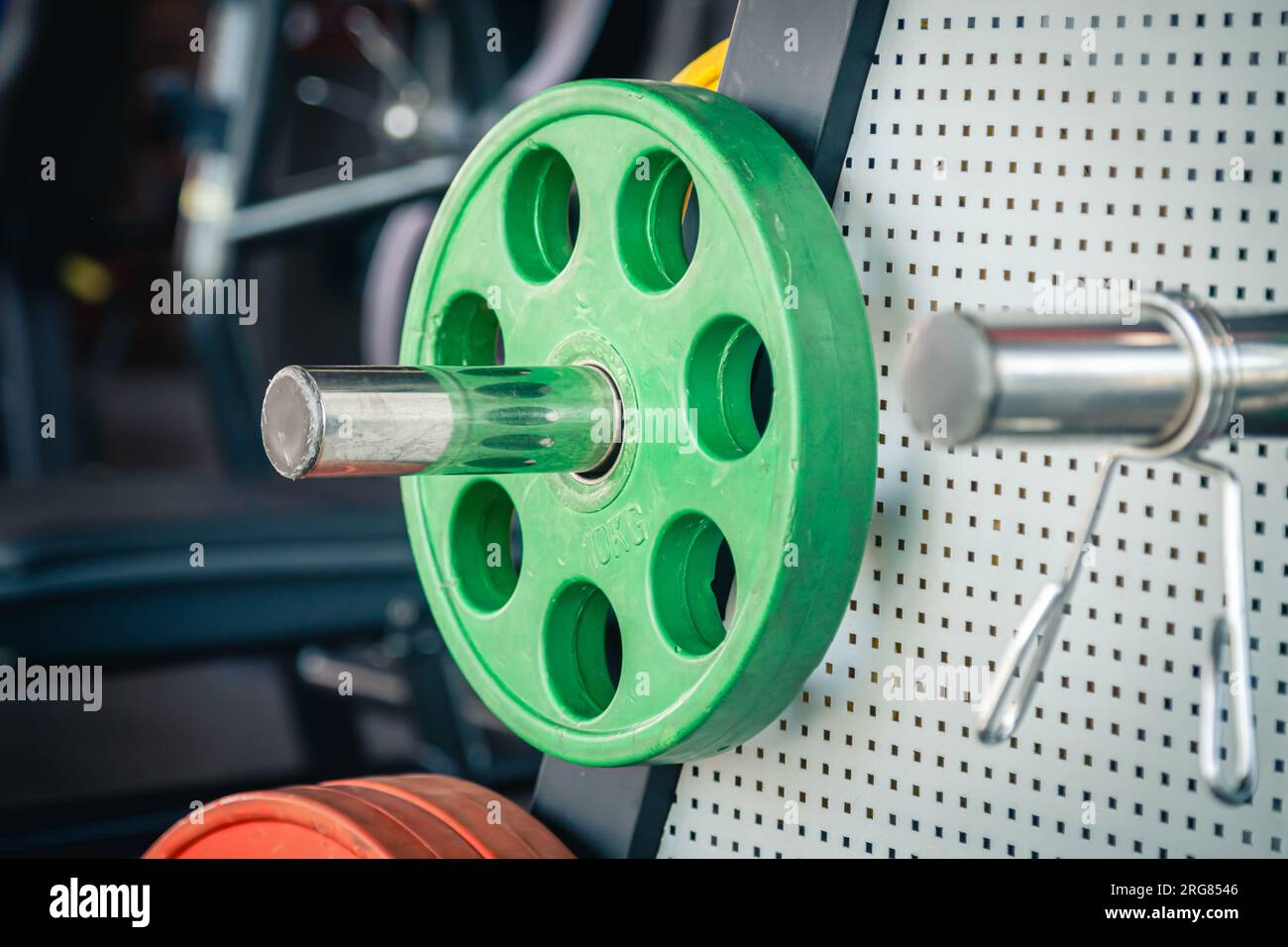 Barbell ready to workout in gym, various sizes of weight plates Stock