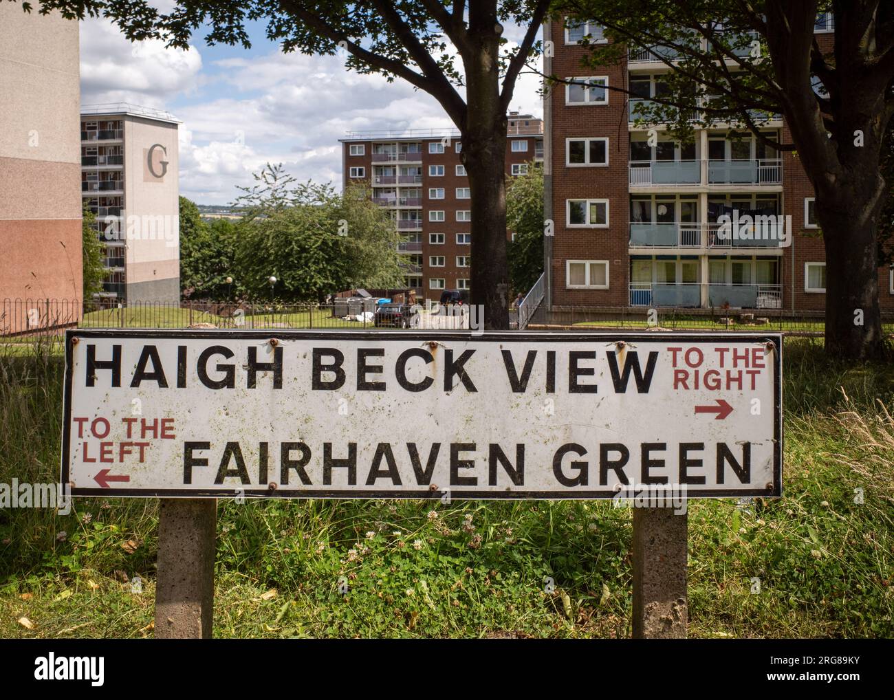 Street sign in Thorpe Edge looking down towards tower blocks in the suburbs of Bradford, England, UK. Housing, street, 1950's architecture. UK Stock Photo