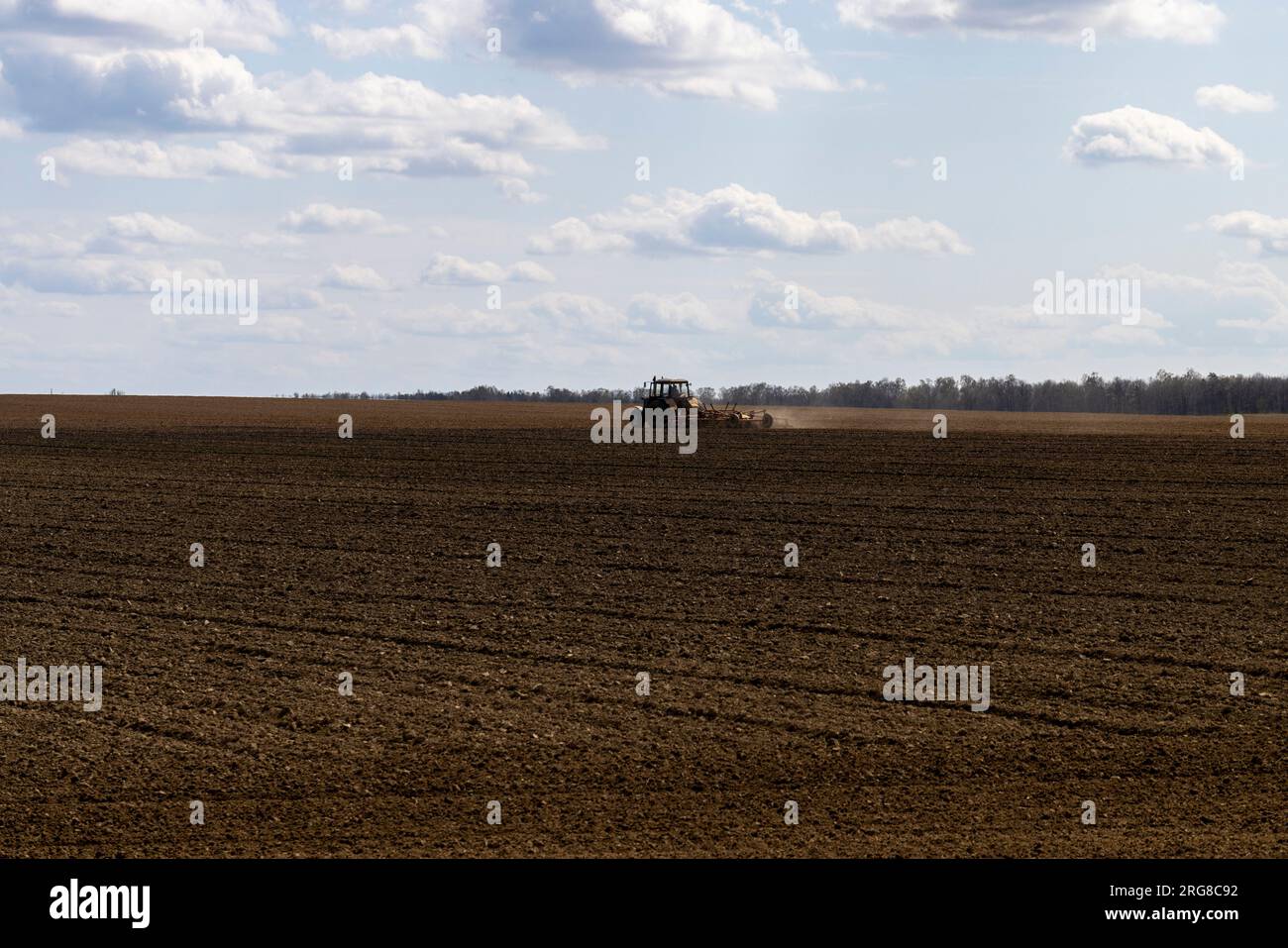 plowed soil in an agricultural field during tillage, agriculture and ...