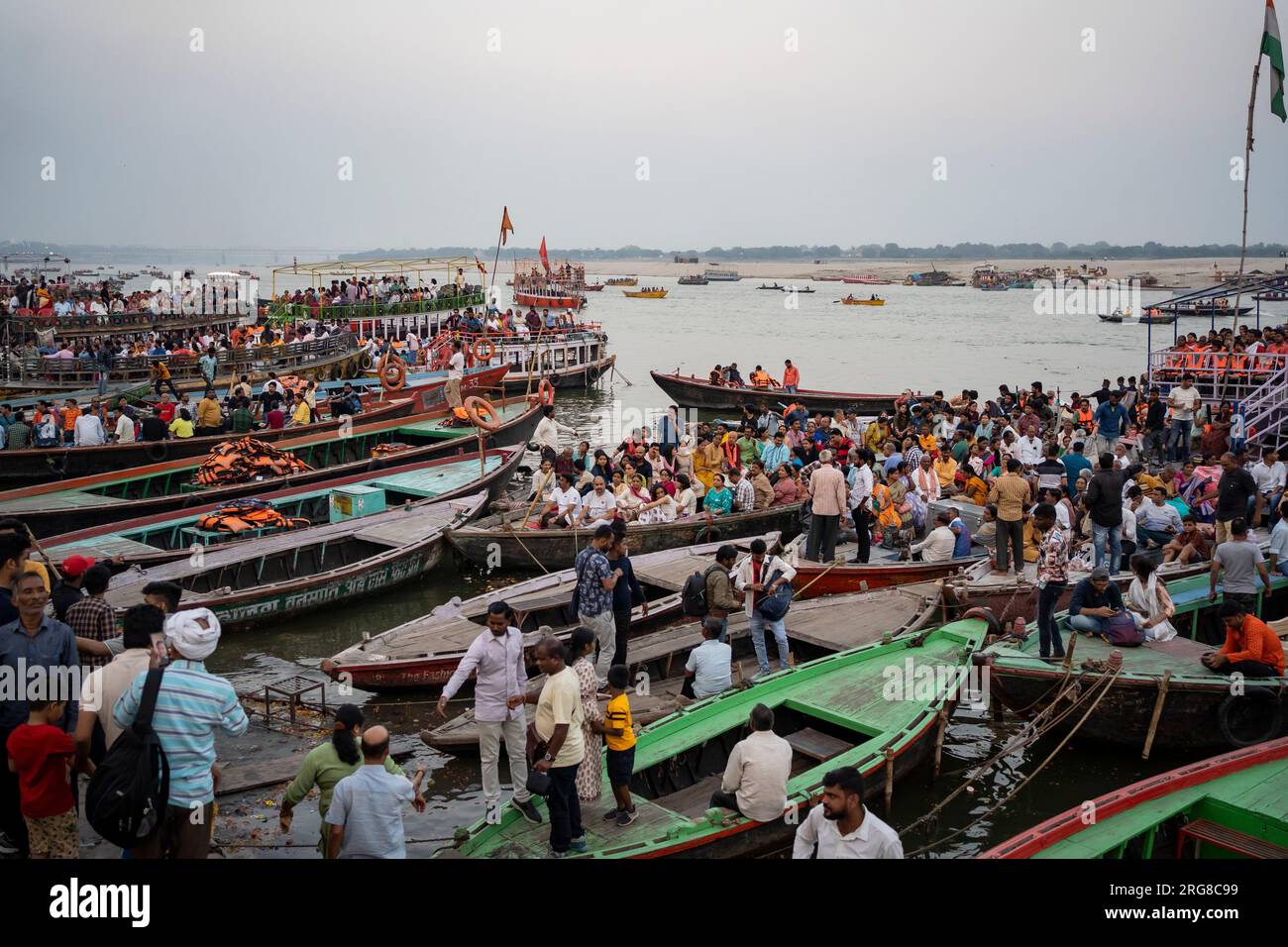 Varanasi India - March 12 2023 Devotees watching Ganga worship on Dashashvamedh Ghat, Varanasi, India Stock Photo