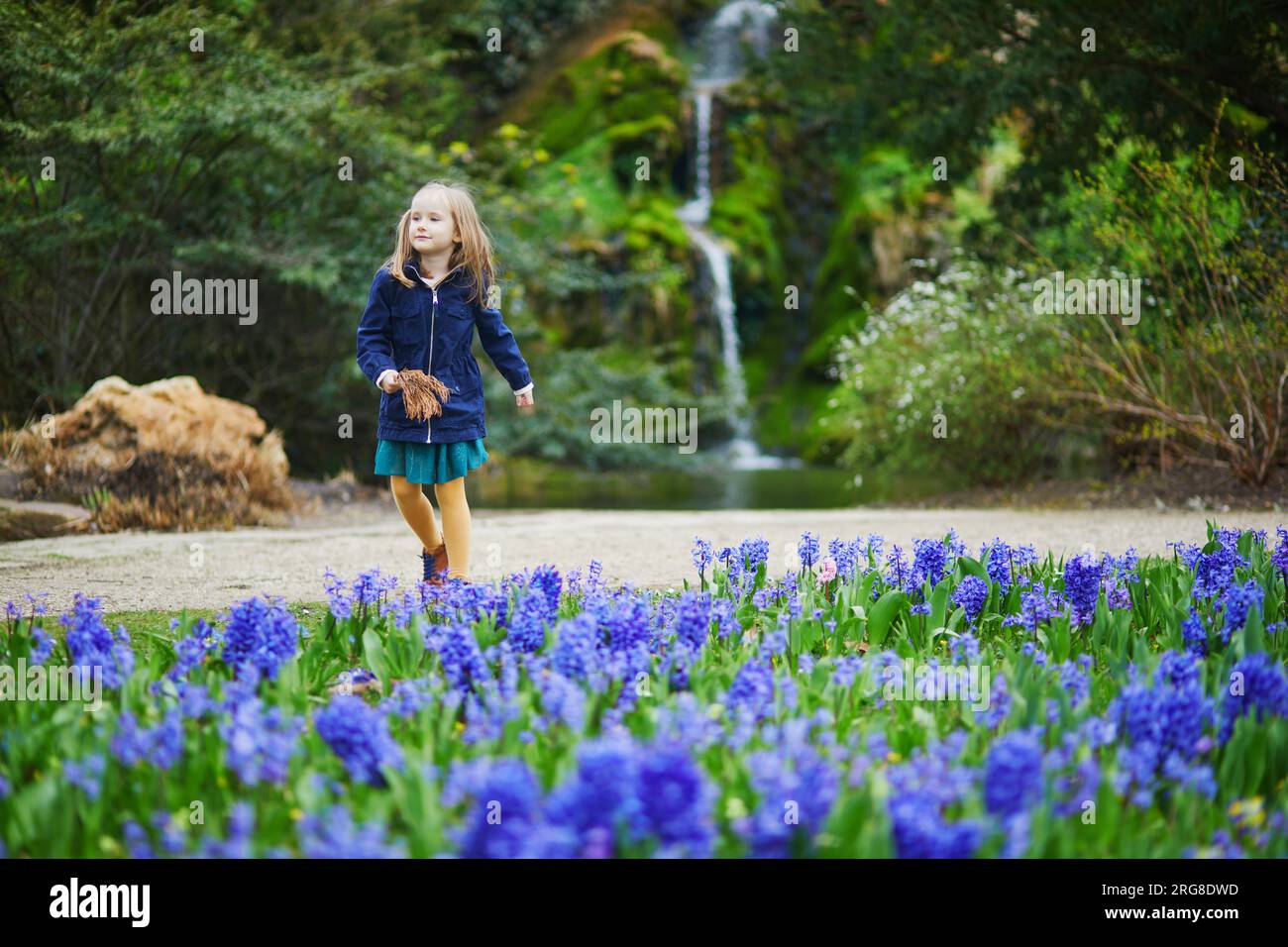 Spring Time For Kids Adorable preschooler girl enjoying nice spring day in park during ...