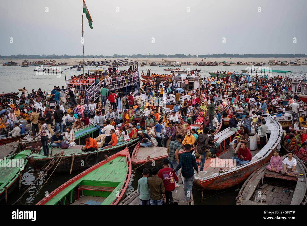 Varanasi India - March 12 2023 Devotees watching Ganga worship on Dashashvamedh Ghat, Varanasi, India Stock Photo